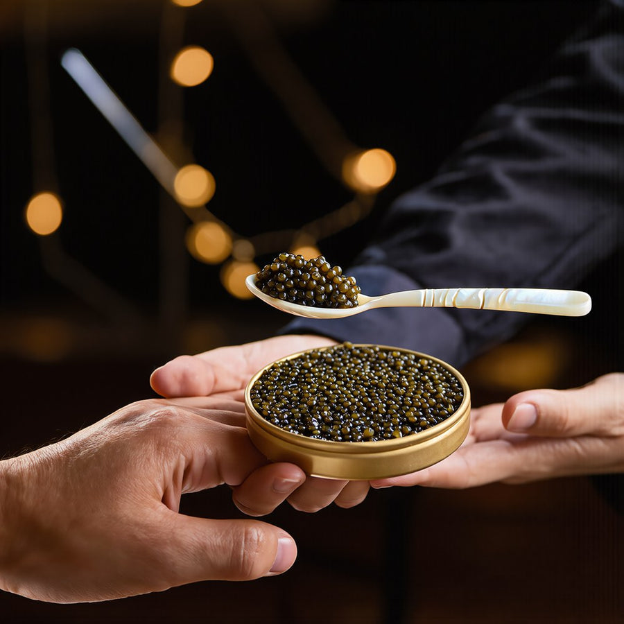 Caviar hostess serving Empero caviar with a mother-of-pearl spoon