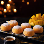 Mango mini mochi served on a black plate with espresso